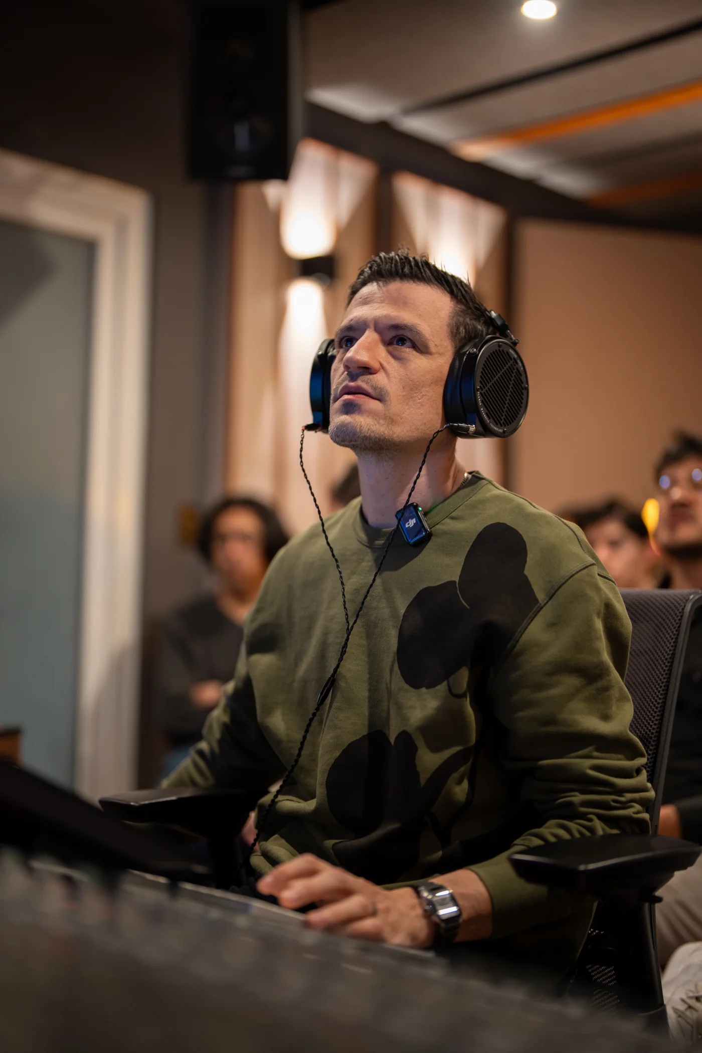 A SoundAdvice participant listening closely on studio headphones